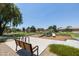 Community playground with playset and bench at 17555 W Dalea Dr, Goodyear, AZ 85338