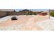 Spacious backyard with flagstone patio, fire pit, and spa at 17555 W Dalea Dr, Goodyear, AZ 85338