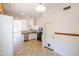 Kitchen with stainless steel dishwasher and view into living room at 17555 W Dalea Dr, Goodyear, AZ 85338