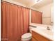 Clean bathroom with shower/tub combo and wood vanity at 17555 W Dalea Dr, Goodyear, AZ 85338