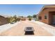 Backyard with flagstone patio, fire pit and spa at 17555 W Dalea Dr, Goodyear, AZ 85338