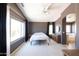 Spacious Primary bedroom with large window and en-suite bathroom at 17555 W Dalea Dr, Goodyear, AZ 85338