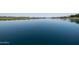 Serene lake view with calm waters and a tranquil setting at 17555 W Dalea Dr, Goodyear, AZ 85338
