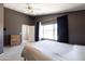 Bright bedroom with double door access to backyard at 17555 W Dalea Dr, Goodyear, AZ 85338