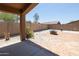Landscaped backyard with patio and fire pit at 17555 W Dalea Dr, Goodyear, AZ 85338