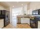 Open concept kitchen with stainless steel appliances at 17555 W Dalea Dr, Goodyear, AZ 85338