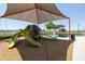Shaded playground with slides, climbing structures, and play area at 17555 W Dalea Dr, Goodyear, AZ 85338