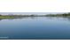 Tranquil lake view, reflecting the surrounding landscape at 17555 W Dalea Dr, Goodyear, AZ 85338