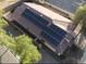 House with solar panels and red tile roof, seen from the side at 1371 E Judi Dr, Casa Grande, AZ 85122