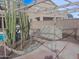Landscaped backyard with a pergola and cacti at 44973 W Sandhill Rd, Maricopa, AZ 85139