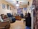 Home office features wood flooring, a large desk, and comfortable seating at 44973 W Sandhill Rd, Maricopa, AZ 85139