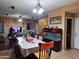 Spacious dining area with large table and views into the living room at 44973 W Sandhill Rd, Maricopa, AZ 85139