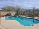 Inviting swimming pool with a tranquil desert landscape at 44973 W Sandhill Rd, Maricopa, AZ 85139
