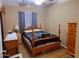 Charming bedroom with wood flooring and a comfortable bed at 44973 W Sandhill Rd, Maricopa, AZ 85139