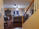 Spacious living room with hardwood floors, comfortable seating, and staircase view at 44973 W Sandhill Rd, Maricopa, AZ 85139