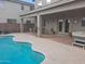 Large backyard with a refreshing pool, covered patio, and hot tub at 44973 W Sandhill Rd, Maricopa, AZ 85139