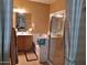 Bathroom boasts a bathtub, shower, and updated cabinetry at 44973 W Sandhill Rd, Maricopa, AZ 85139