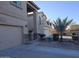 Two story house with tan exterior, balcony, and attached garage at 44973 W Sandhill Rd, Maricopa, AZ 85139