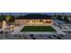 Backyard oasis with firepit, lawn, and outdoor dining area at 1896 E Cloud Rd, Phoenix, AZ 85086