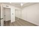 Bright bedroom with mirrored closet doors and wood-look flooring at 916 S Melody Ln, Tempe, AZ 85281