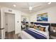 Comfortable bedroom with a navy blue headboard and artwork at 916 S Melody Ln, Tempe, AZ 85281