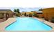 Community swimming pool with plenty of space for lounging at 916 S Melody Ln, Tempe, AZ 85281