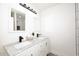 Double vanity bathroom with marble countertop and modern fixtures at 916 S Melody Ln, Tempe, AZ 85281