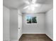 Bright bedroom with tile floors and a window overlooking the backyard at 2236 E Nancy Ln, Phoenix, AZ 85042