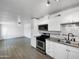 Bright kitchen featuring white cabinets, stainless steel appliances, and tile flooring at 2236 E Nancy Ln, Phoenix, AZ 85042
