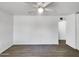 Simple living room with tile floors and a ceiling fan at 2236 E Nancy Ln, Phoenix, AZ 85042