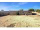 Large backyard with a mostly dirt surface and a view of the back of the house at 2236 E Nancy Ln, Phoenix, AZ 85042