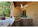 Outdoor kitchen with built-in grill and granite countertops at 36631 N Peaceful Pl, Carefree, AZ 85377