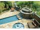 Relaxing pool and spa with a gorgeous waterfall feature and lounge chairs at 36631 N Peaceful Pl, Carefree, AZ 85377