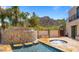 Large cascading waterfall feature next to a spa and pool at 36631 N Peaceful Pl, Carefree, AZ 85377