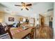 Open concept dining area with hardwood floors and view of living room and kitchen at 2101 S Meridian Rd # 204, Apache Junction, AZ 85120