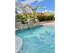 Inviting pool with stone accents and lush landscaping at 18206 W Sells Dr, Goodyear, AZ 85395