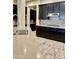 Modern kitchen with stainless steel appliances and tile backsplash at 18206 W Sells Dr, Goodyear, AZ 85395