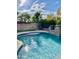 Sparkling pool with a stone waterfall feature at 18206 W Sells Dr, Goodyear, AZ 85395