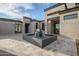 Modern courtyard with water feature and stone pavers at 7147 E Wilderness Trl, Gold Canyon, AZ 85118