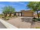 House exterior with a two-car garage and landscaped yard at 32269 N 133Rd Dr, Peoria, AZ 85383
