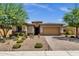 Beautiful curb appeal with landscaping and a two-car garage at 32269 N 133Rd Dr, Peoria, AZ 85383