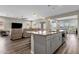 Open concept kitchen with island and modern appliances at 32269 N 133Rd Dr, Peoria, AZ 85383