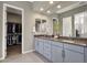 Primary bathroom with double sinks and large closet at 32269 N 133Rd Dr, Peoria, AZ 85383
