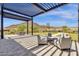 Covered patio with comfortable seating and mountain views at 32269 N 133Rd Dr, Peoria, AZ 85383