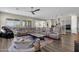 Spacious living room with comfortable seating and large windows at 32269 N 133Rd Dr, Peoria, AZ 85383