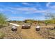 Community fire pit with seating and desert landscaping at 32269 N 133Rd Dr, Peoria, AZ 85383