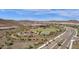 Aerial view of community amenities, including a playground, basketball court, and pool at 32269 N 133Rd Dr, Peoria, AZ 85383