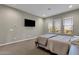 Spacious bedroom with large windows and plush carpet at 32269 N 133Rd Dr, Peoria, AZ 85383