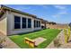 Landscaped backyard with artificial turf and cornhole at 32269 N 133Rd Dr, Peoria, AZ 85383
