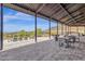 Covered patio with seating and mountain views at 32269 N 133Rd Dr, Peoria, AZ 85383